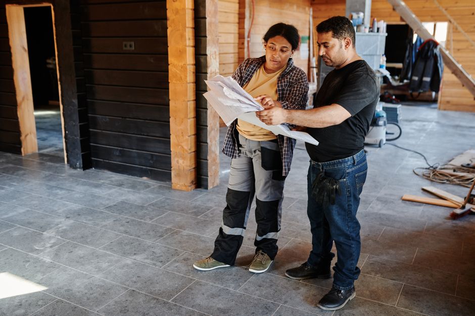 Contractor carefully measuring for a bathroom remodeling project